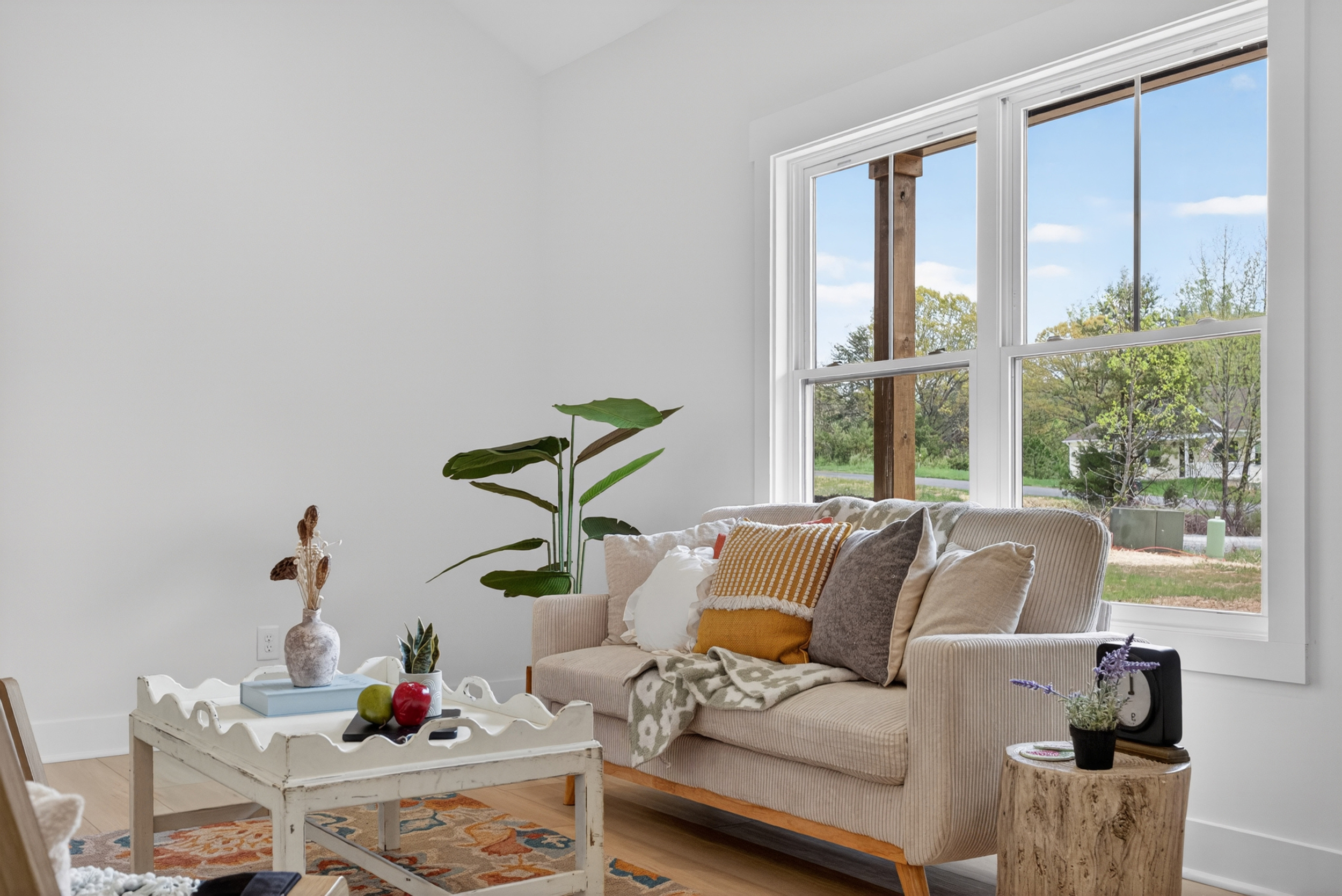Couch and coffee table in a bright living room.